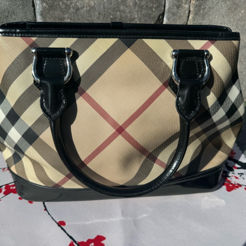 Burberry purse , black , red, white and tan